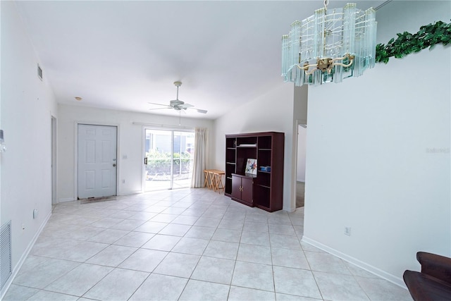 3300 Loveland Blvd Unit 2103, Punta Gorda, FL 33980 - unfurnished living room with light tile patterned floors, visible vents, baseboards, and ceiling fan with notable chandelier