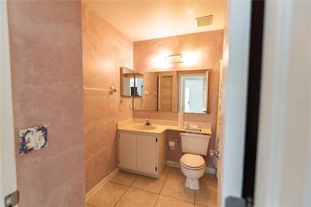 3300 Loveland Blvd Unit 2103, Punta Gorda, FL 33980 - bathroom featuring tile patterned flooring, vanity, toilet, baseboards, and visible vents