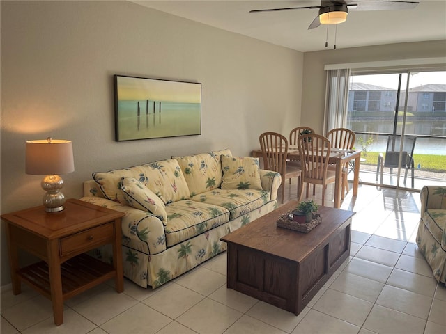 living room featuring ceiling fan and light tile patterned flooring