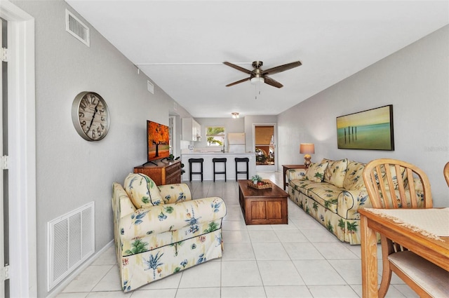 25100 Sandhill Blvd Unit R104, Punta Gorda, FL 33983 - living area with ceiling fan and light tile patterned floors
