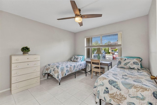 25100 Sandhill Blvd Unit R104, Punta Gorda, FL 33983 - bedroom with light tile patterned flooring, baseboards, and ceiling fan