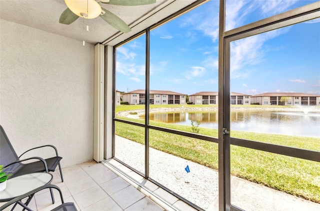 25100 Sandhill Blvd Unit R104, Punta Gorda, FL 33983 - unfurnished sunroom with ceiling fan, a water view, and a residential view
