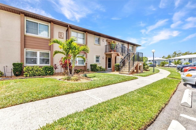 25100 Sandhill Blvd Unit R104, Punta Gorda, FL 33983 - view of building exterior with stairway