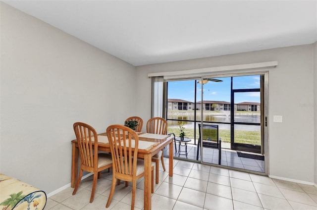 25100 Sandhill Blvd Unit R104, Punta Gorda, FL 33983 - dining room with baseboards, a water view, and light tile patterned flooring