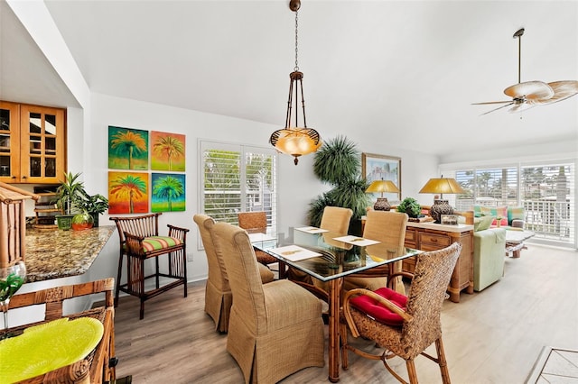 12130 Siesta Dr, Fort Myers Beach, FL 33931 - dining room featuring a ceiling fan and light wood-style flooring