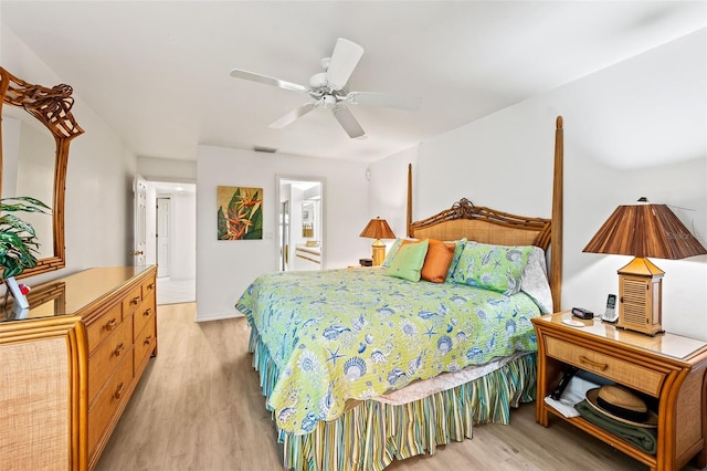 12130 Siesta Dr, Fort Myers Beach, FL 33931 - bedroom featuring a ceiling fan, visible vents, ensuite bath, and light wood finished floors