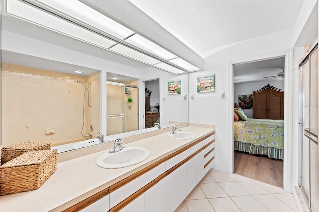 12130 Siesta Dr, Fort Myers Beach, FL 33931 - full bathroom featuring tile patterned floors, a shower stall, a sink, and ensuite bathroom