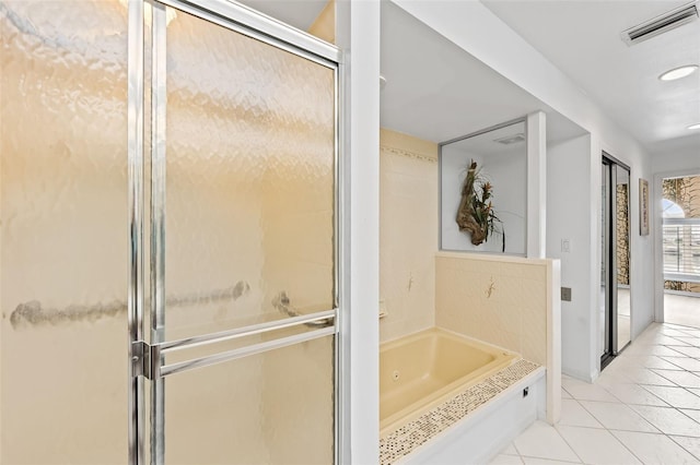 12130 Siesta Dr, Fort Myers Beach, FL 33931 - full bath with tile patterned flooring, visible vents, a shower stall, and a tub with jets