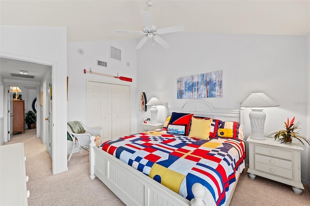 12130 Siesta Dr, Fort Myers Beach, FL 33931 - bedroom featuring light colored carpet, a closet, visible vents, and ceiling fan