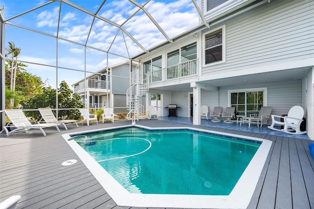 12130 Siesta Dr, Fort Myers Beach, FL 33931 - outdoor pool featuring glass enclosure and grilling area