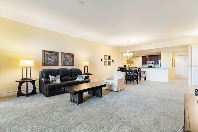 85 Vivante Blvd Unit 8542, Punta Gorda, FL 33950 - living area featuring baseboards, an inviting chandelier, and light colored carpet