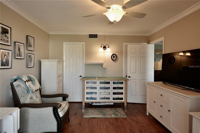 living area featuring ornamental molding, dark wood-style flooring, visible vents, and a ceiling fan