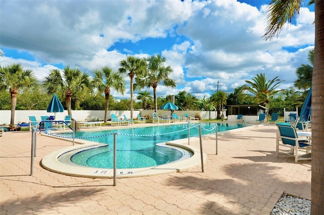 pool featuring a patio and fence