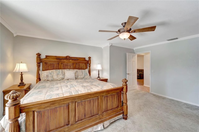 bedroom featuring visible vents, light carpet, ornamental molding, a ceiling fan, and baseboards