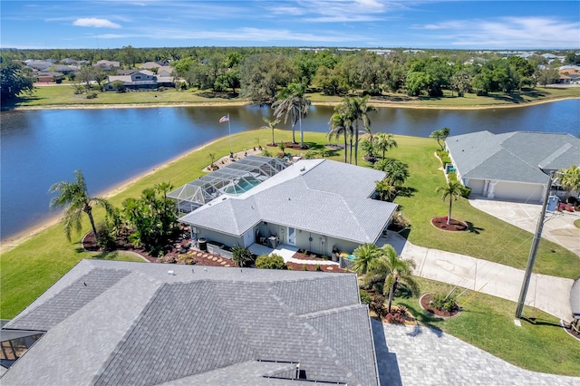 birds eye view of property with a water view