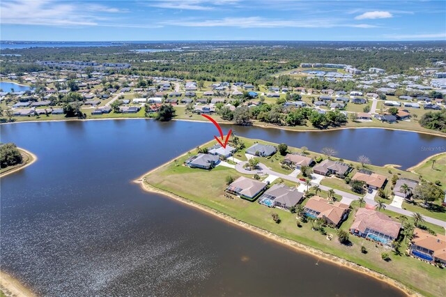 bird's eye view with a residential view and a water view