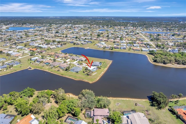 aerial view with a residential view and a water view