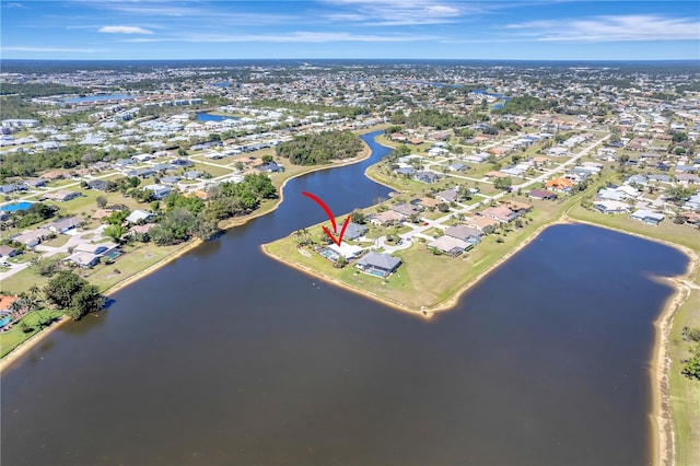 birds eye view of property featuring a residential view and a water view