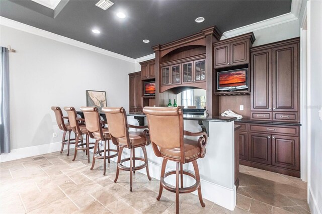 bar with visible vents, recessed lighting, ornamental molding, decorative backsplash, and a dry bar