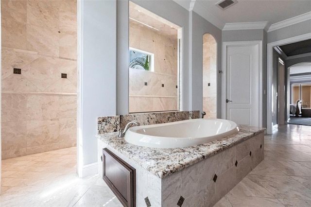 full bath featuring visible vents, a garden tub, marble finish floor, crown molding, and baseboards