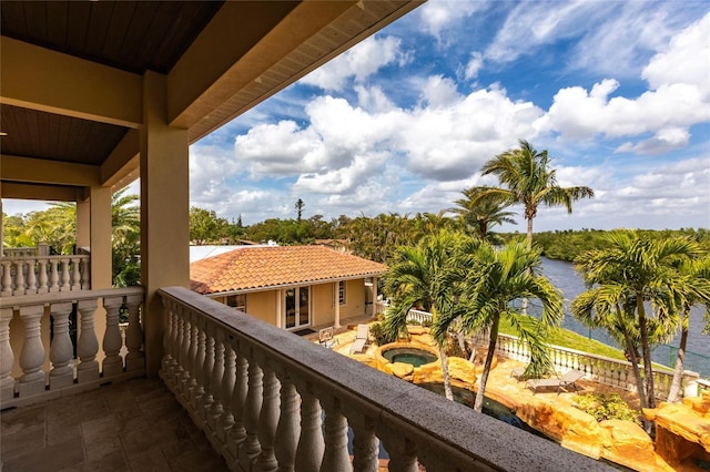 balcony featuring a water view