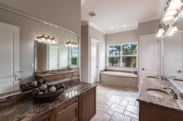 bathroom featuring visible vents, a healthy amount of sunlight, and a sink