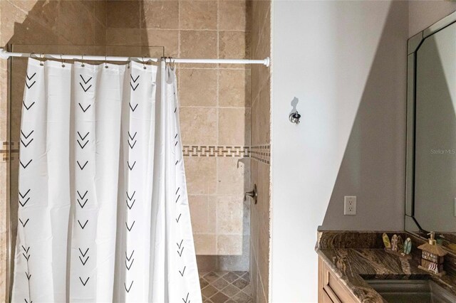 full bath with vanity and a shower with shower curtain