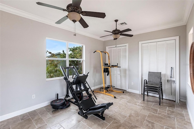 workout area with crown molding, stone finish floor, visible vents, and baseboards