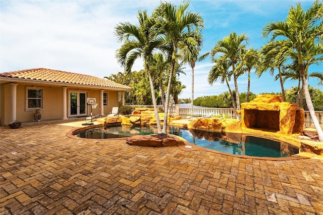 view of pool with a patio area, a fenced in pool, french doors, and fence