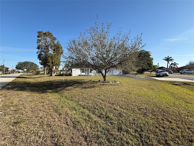 view of yard with an attached garage