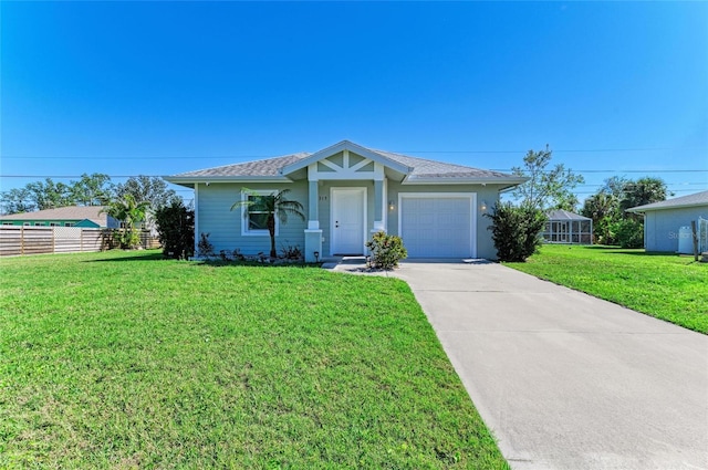 ranch-style house with a garage, concrete driveway, fence, and a front lawn