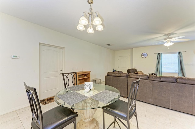 315 Southland Rd, Venice, FL 34293 - dining space with light tile patterned floors, ceiling fan with notable chandelier, visible vents, and baseboards
