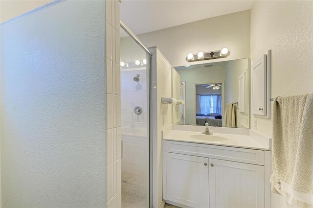 315 Southland Rd, Venice, FL 34293 - bathroom featuring a shower stall, ensuite bath, vanity, and a textured wall