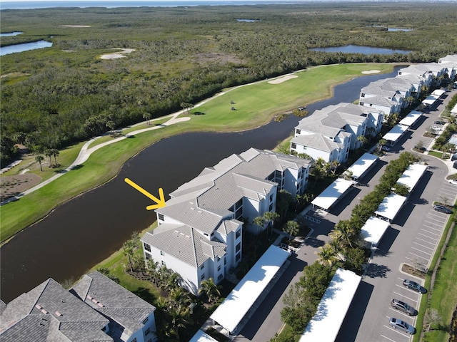 bird's eye view with golf course view and a water view