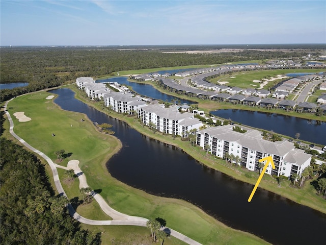 drone / aerial view with a water view and golf course view