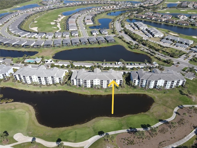 aerial view featuring a residential view and a water view