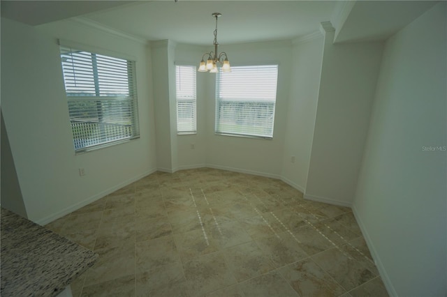 unfurnished room with baseboards, plenty of natural light, an inviting chandelier, and crown molding