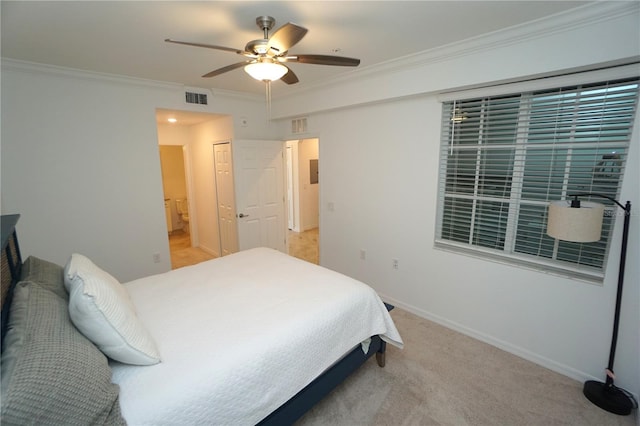 bedroom featuring light carpet, a ceiling fan, baseboards, visible vents, and crown molding