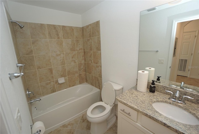 bathroom with  shower combination, tile patterned floors, toilet, and vanity