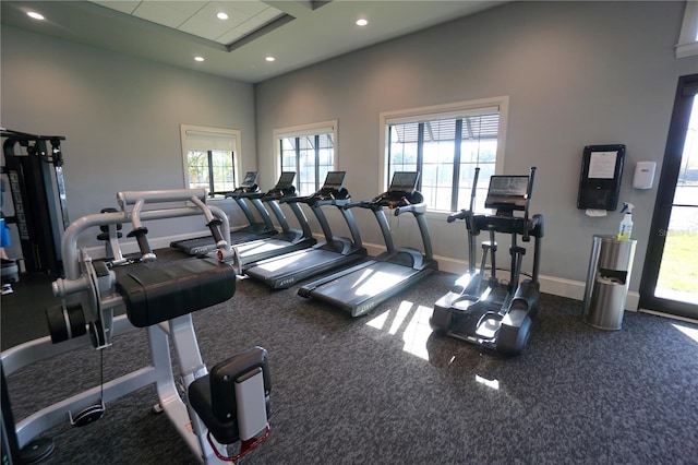 workout area with recessed lighting and baseboards