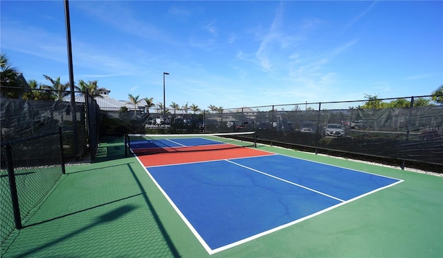 view of sport court featuring community basketball court and fence