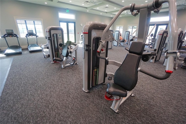 workout area with recessed lighting, french doors, a towering ceiling, and baseboards