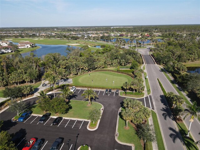 bird's eye view featuring a water view and view of golf course