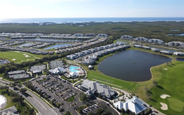 bird's eye view featuring a water view and view of golf course