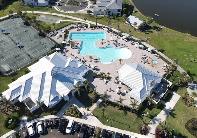 birds eye view of property with a water view