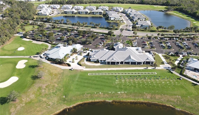 aerial view featuring golf course view and a water view