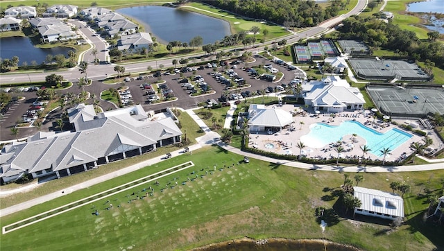 birds eye view of property with a water view