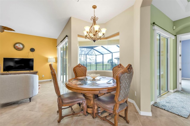 dining room with lofted ceiling, a sunroom, baseboards, and light tile patterned floors