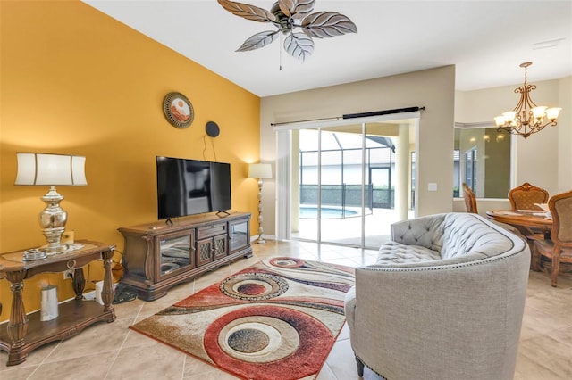 tiled living area with baseboards and ceiling fan with notable chandelier