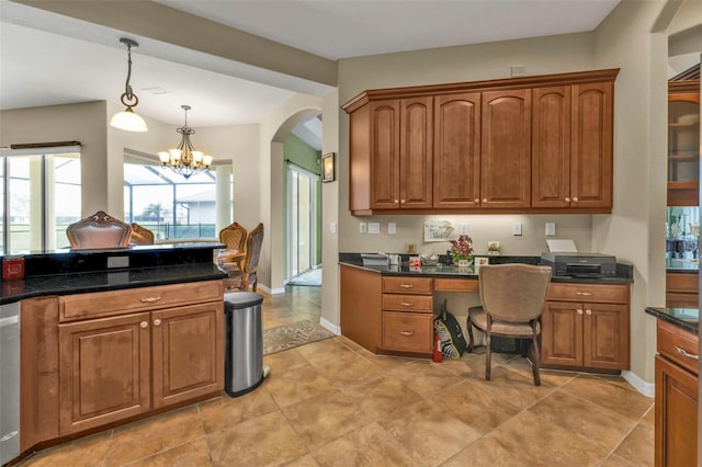 kitchen featuring pendant lighting, an inviting chandelier, baseboards, and brown cabinets